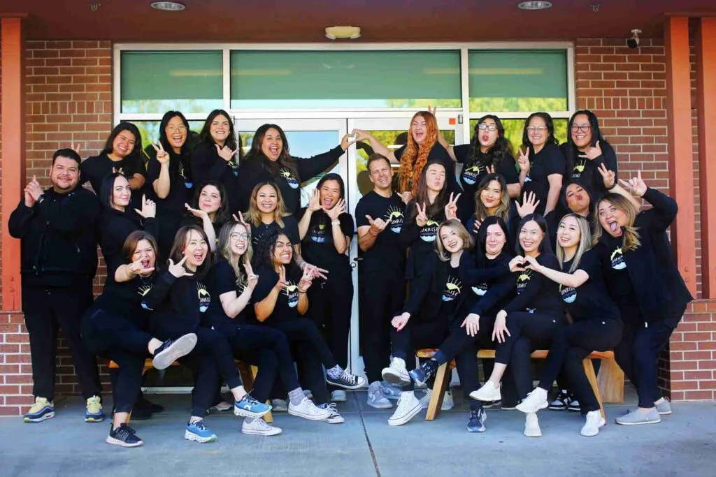 Sunrise Orthodontics team smiling together for a fun group photo